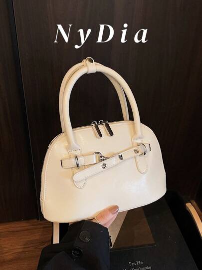 1 件简单百搭的优质纯色被子可作为小包携带，配有装饰带。适合外出购物、上下班、约会、度假和旅行。女士时尚单肩包斜挎包