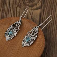 1 paire de boucles d'oreilles rétro créatives en forme de plume avec turquoise pour femmes