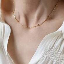 Conjunto de joyería de collar y pulsera con forma de corazón romántica, de acero de titanio en tono dorado, diseño único para mujer