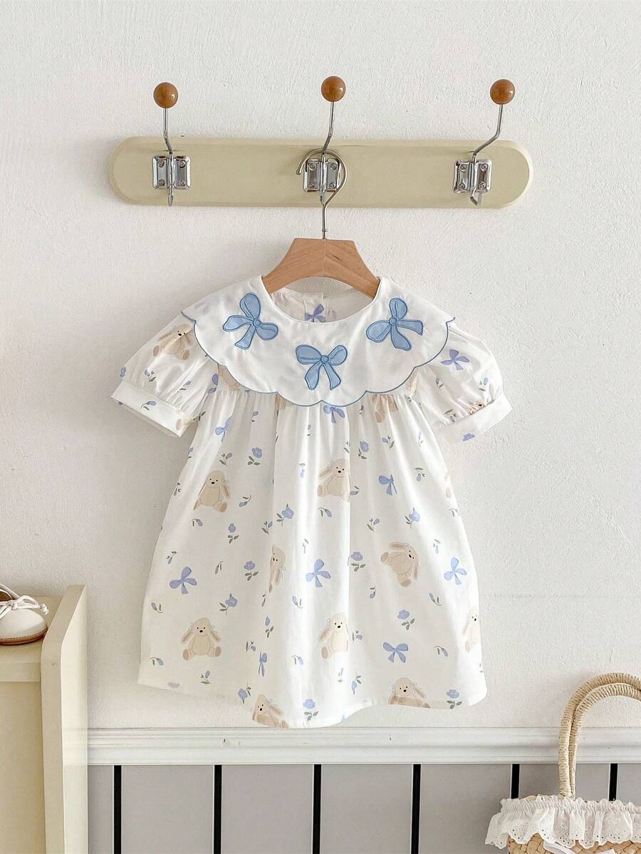 Váy bé gái dễ thương hình gấu, nơ và họa tiết hoa xếp nếp