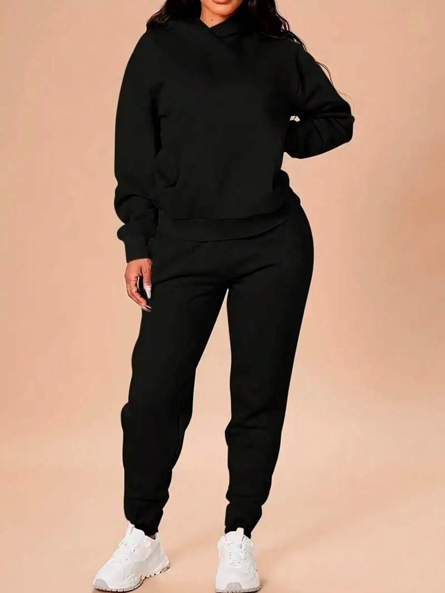 A Two Piece Set Consisting Of A Solid Color Long Sleeve Kangaroo Sweatshirt And Tracksuit Jogger Sweatpants - Black - View 1