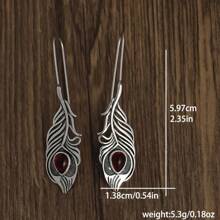 1 paire de boucles d'oreilles rétro créatives en forme de plume avec turquoise pour femmes