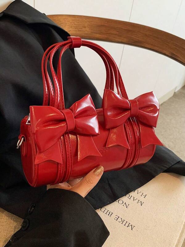 حقيبة يد صغيرة أسطوانية عتيقة مزينة بفيونكة من جلد البولي يوريثان الأحمر عصرية