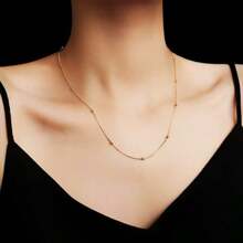 Conjunto de joyería de collar y pulsera con forma de corazón romántica, de acero de titanio en tono dorado, diseño único para mujer