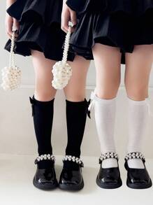 2 双女孩纯色蝴蝶结装饰透气及膝袜，适合日常穿着