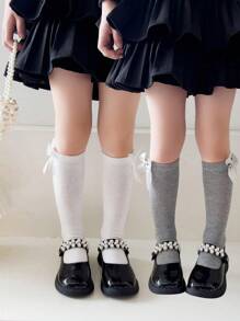 2 双女孩纯色蝴蝶结装饰透气及膝袜，适合日常穿着