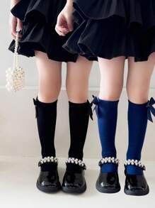 2 双女孩纯色蝴蝶结装饰透气及膝袜，适合日常穿着