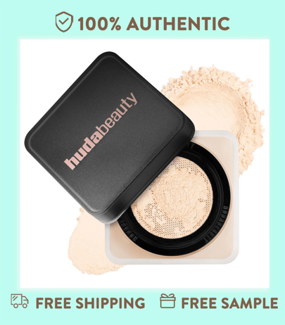 Huda Beauty 0.71 Oz / 20 G Polvo suelto para hornear y fijar fácilmente - Tonos de piel clara a media. Tonos rosados iluminan y disfrazan la oscuridad debajo de los ojos.