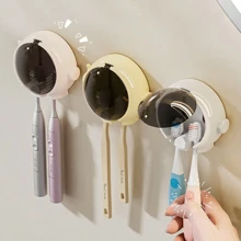 Uchwyt na szczoteczkę do zębów w kształcie astronauty. Bez wiertarki, łazienkowy elektryczny stojak na szczoteczki do zębów. Uchwyt na szczoteczkę do zębów w kształcie kreskówki. Prezentowy organizer do przechowywania szczoteczek do zębów, uchwyt na szczoteczkę do zębów, ścienny minimalistyczny, pyłoszczelny wieszak na szczoteczki do zębów bez wiercenia, z automatycznie zamykaną pokrywą. Uroczy uchwyt na szczoteczkę do zębów w kształcie astronauty, bez wiertarki, łazienkowy organizer na szczoteczki do zębów montowany na ścianie do domu, hotelu, akademika.