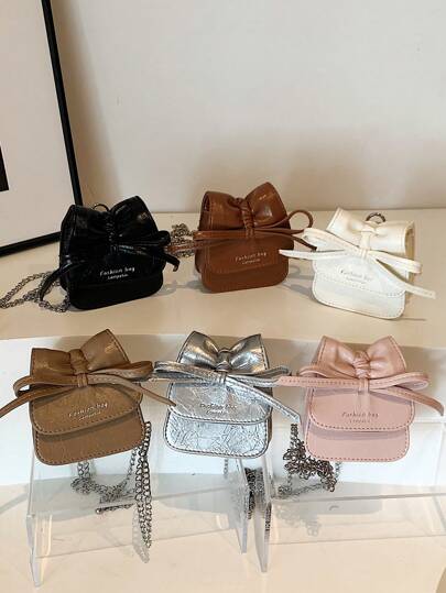 1 件新款迷你蝴蝶结装饰 PU 材质女孩斜挎包，金属肩带，磁扣，精致小巧，时尚百搭，适合日常外出、购物、聚会和朋友礼物