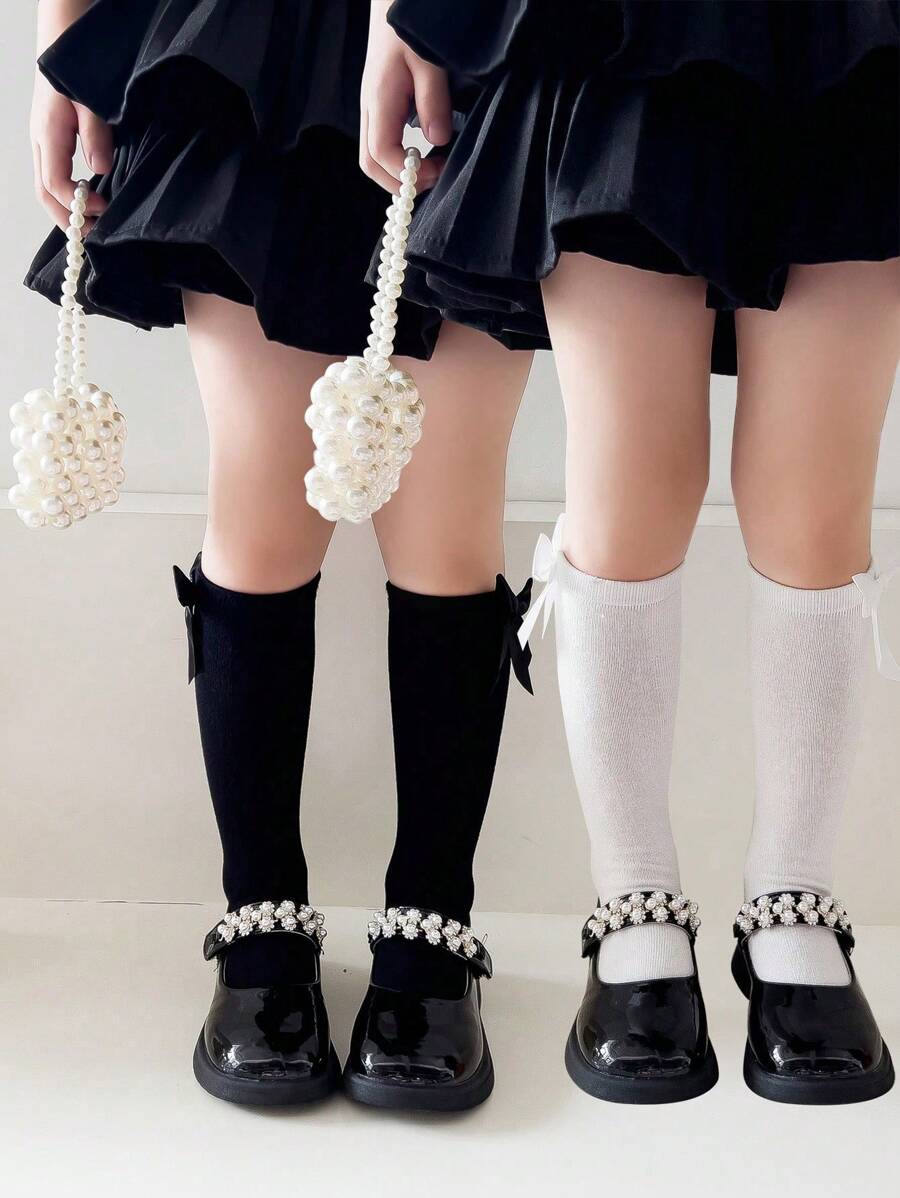 2 双女孩纯色蝴蝶结装饰透气及膝袜，适合日常穿着