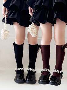 2 双女孩纯色蝴蝶结装饰透气及膝袜，适合日常穿着