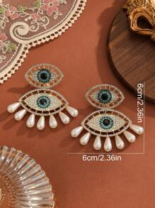 1 paire de boucles d'oreilles pour femme mode dramatique avec strass et faux perles en forme d'œil de diable, convient pour toutes les saisons, les soirées et le travail