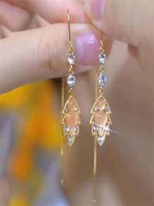 1 par de orejeras con ojos de gato de cristal y borlas, diseño elegante, adecuado para festivales y uso diario