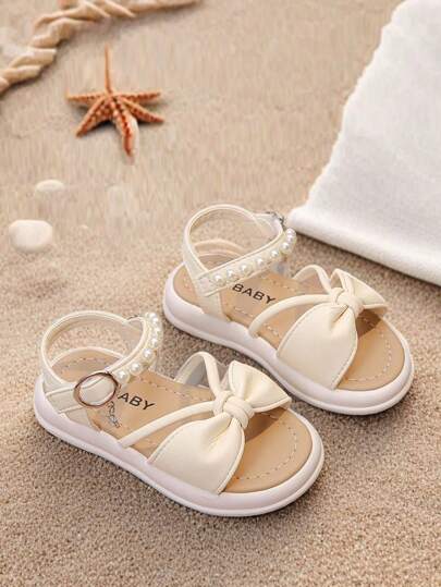 新款女童蝴蝶结装饰凉鞋，儿童软底防滑沙滩鞋，夏季时尚公主鞋