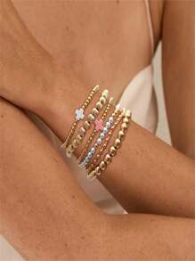 Set de 6 pulseras apilables con perlas falsas de estilo dorado