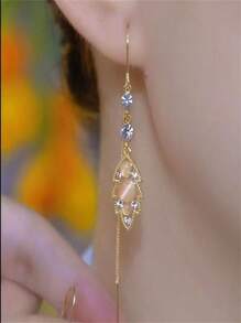 1 par de orejeras con ojos de gato de cristal y borlas, diseño elegante, adecuado para festivales y uso diario