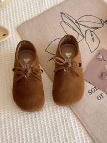 女童蝴蝶结纯色百搭公主鞋，2025年春季新款女童防滑皮革平底鞋，绒面软底乐福鞋复古奶奶鞋