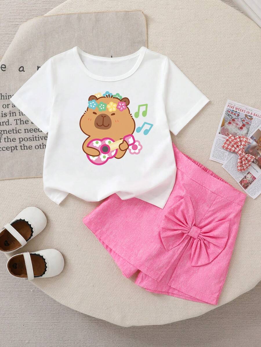 Set de 2 piezas de camiseta blanca con estampado de dibujos animados y shorts de falda rosa para niña joven, adorable y dulce, adecuado para exterior, vacaciones, verano - Blanco - Ver 1