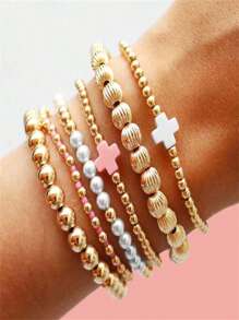 Set de 6 pulseras apilables con perlas falsas de estilo dorado