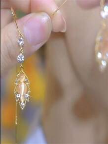 1 par de orejeras con ojos de gato de cristal y borlas, diseño elegante, adecuado para festivales y uso diario