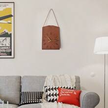 Une horloge de sac suspendu au design créatif d'art moderne. Décoration vintage personnalisée pour le salon. Horloge décorative silencieuse pour la maison et la chambre à coucher. Pendentif d'horloge de style moderne et luxueux, très attrayant. Horloge murale en forme de sac pour restaurant et café