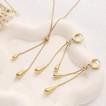Set de 2 piezas: Pendientes ajustables de gota de agua y collar con cadena de hueso de serpiente de acero de titanio