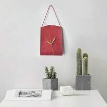 Une horloge de sac suspendu au design créatif d'art moderne. Décoration vintage personnalisée pour le salon. Horloge décorative silencieuse pour la maison et la chambre à coucher. Pendentif d'horloge de style moderne et luxueux, très attrayant. Horloge murale en forme de sac pour restaurant et café
