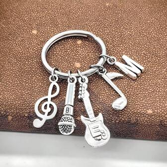 1 Set de 26 llaveros con temática musical - Letra, nota musical, colgante de guitarra, llavero de micrófono, regalo creativo para amantes de la música, adornos para bolsas de Navidad, regalos para amigos, maestros y hermanas
