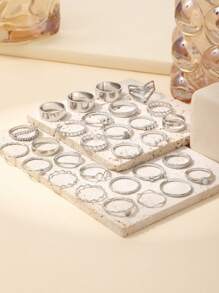 Set de 30 piezas de anillos de nudillo elegantes y lujosos con triángulos de cristal de onda infinita apilados, un diseño sofisticado y de moda adecuado para uso diario, fiestas y bodas