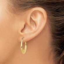 The Black Bow Tapered Puffed Oval Hoop Earrings In 14k Yellow Gold