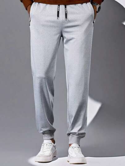 男士春夏户外运动休闲裤商务拉链口袋松紧腰印花直筒透气时尚长裤