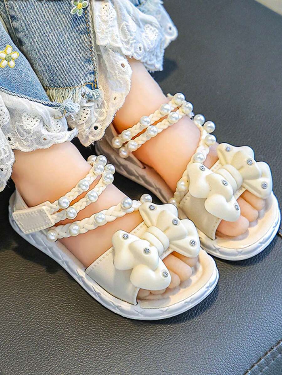 一双轻便舒适、时尚的外套，柔软底部防滑，可爱百搭的公主风格儿童凉鞋，配有珍珠蝴蝶结 - 杏色 - 查看 1