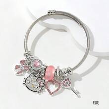 Conjunto con licencia de Sanrio de Hello Kitty de 3 piezas - Pulsera, Collar, Aretes con colgante en forma de corazón, ajustable, Charm de personaje de dibujos animados, joyería de metal rosa, regalo dulce de cumpleaños o San Valentín para niñas, amigos y familia