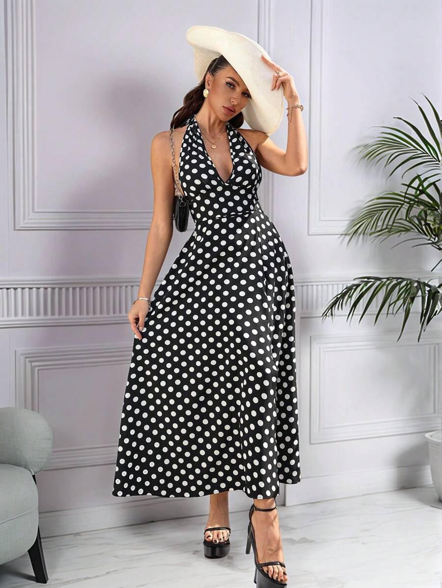 Damska sukienka retro w kropki z odkrytymi plecami i kokardą w talii, elegancka i minimalistyczna