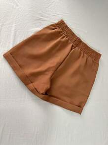 ISA Modas / Short alfaiataria com  detalhe elástico na atrás com bolso com zíper com botão/ elegante/classico