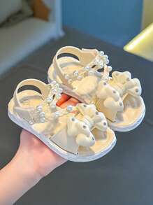 一双轻便舒适、时尚的外套，柔软底部防滑，可爱百搭的公主风格儿童凉鞋，配有珍珠蝴蝶结 - 杏色 - 查看 2