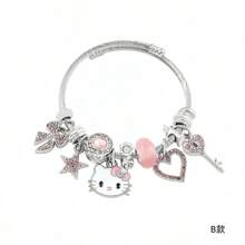 Conjunto con licencia de Sanrio de Hello Kitty de 3 piezas - Pulsera, Collar, Aretes con colgante en forma de corazón, ajustable, Charm de personaje de dibujos animados, joyería de metal rosa, regalo dulce de cumpleaños o San Valentín para niñas, amigos y familia