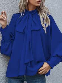 Blusa de manga larga con botón, lazo y estilo suelto de unicolor, estilo europeo y americano para mujeres