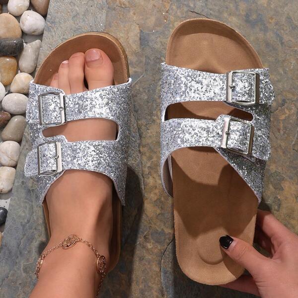 A Pair Of Fashionable And Comfortable Women's Sandals With Sequins And Buckles, Featuring A Soft Sole.