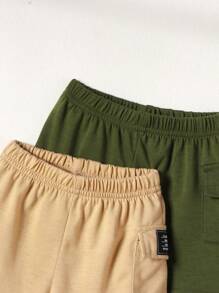 Conjunto de 4 piezas de ropa informal de verano para niño bebé con camisetas de cuello redondo a rayas y de un solo color, y pantalones cortos de bolsillo de un solo color