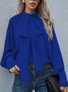 Blusa de manga larga con botón, lazo y estilo suelto de unicolor, estilo europeo y americano para mujeres