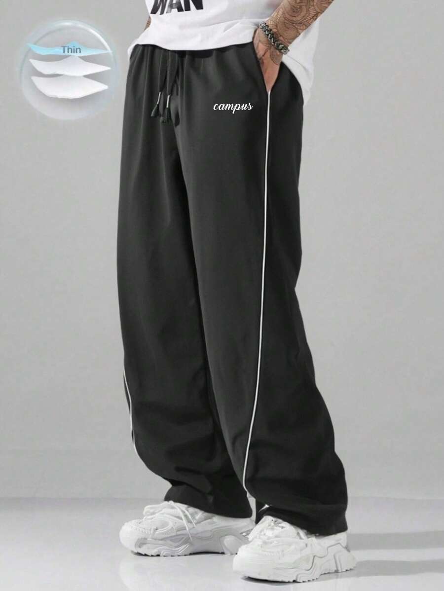 男式轻质撞色修身裤，宽松长款降落伞裤，带字母图案设计，纯黑色，休闲装 - 黑色 - 查看 1
