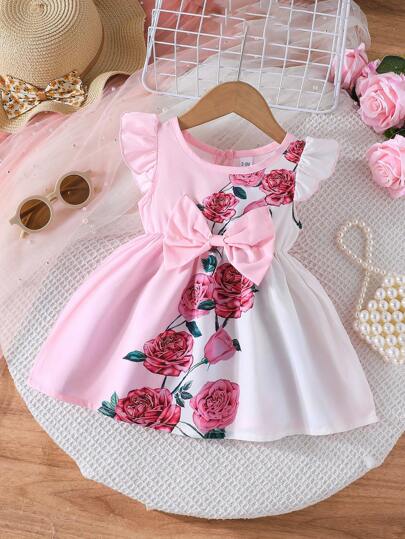 Letnia sukienka dla dziewczynki z kokardą i słodkim kwiatem róży