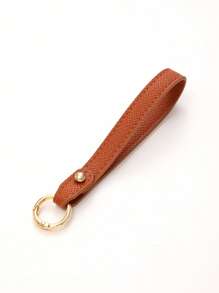1 pièce Nouveau porte-clés en cuir de couleur unie, sangle de poignet, accessoire de sac à bandoulière, chaîne de clé de voiture à la mode, accessoire de voiture détachable, breloques scolaires