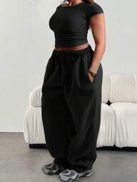 Pantalon de survêtement décontracté et ample pour femmes grandes tailles, de couleur unie, avec taille élastique et poches