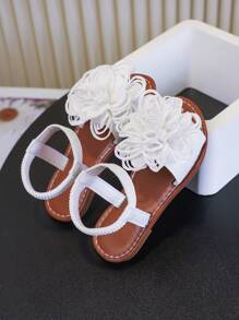 Un par de sandalias para niñas Nuevos zapatos de princesa con lazo, diseño de banda elástica, suela blanda, zapatos casuales de playa para niñas en verano.