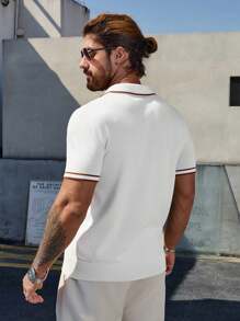 Polo uomo a maniche corte in maglia a tinta unita con bottoni