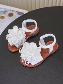 Un par de sandalias para niñas Nuevos zapatos de princesa con lazo, diseño de banda elástica, suela blanda, zapatos casuales de playa para niñas en verano.