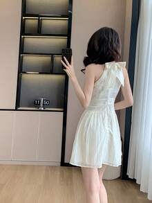 RUIWY Chiffon Apricot Color Waisted Slimming Comfortable Breathable Elegant Fashion Lady Dress, Sleeveless Short Design With Big Bow Back, Suitable For Spring And Summer